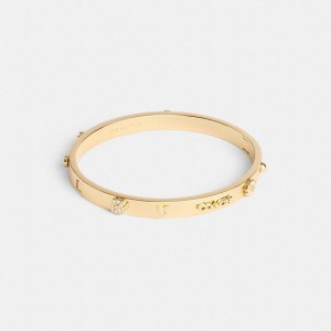 COACH® Pegged Hinged Bangle Women Jewelry Gold | DTOF50418
