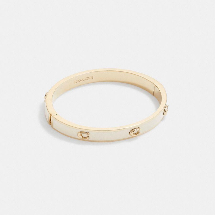 COACH® Pegged Signature Hinged Bangle Women Jewelry Gold | NRIF28471